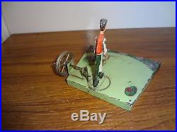 A German Doll et Cie live steam engine driven tinplate toy Gardener farmer Sythe