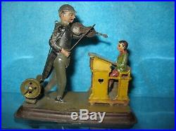 Becker Violinist & Student Tin Painted & Litho Steam engine Toy articulated
