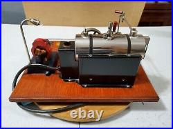 Black Fire box Jensen #10 steam engine with cast iron base generator. 1950's